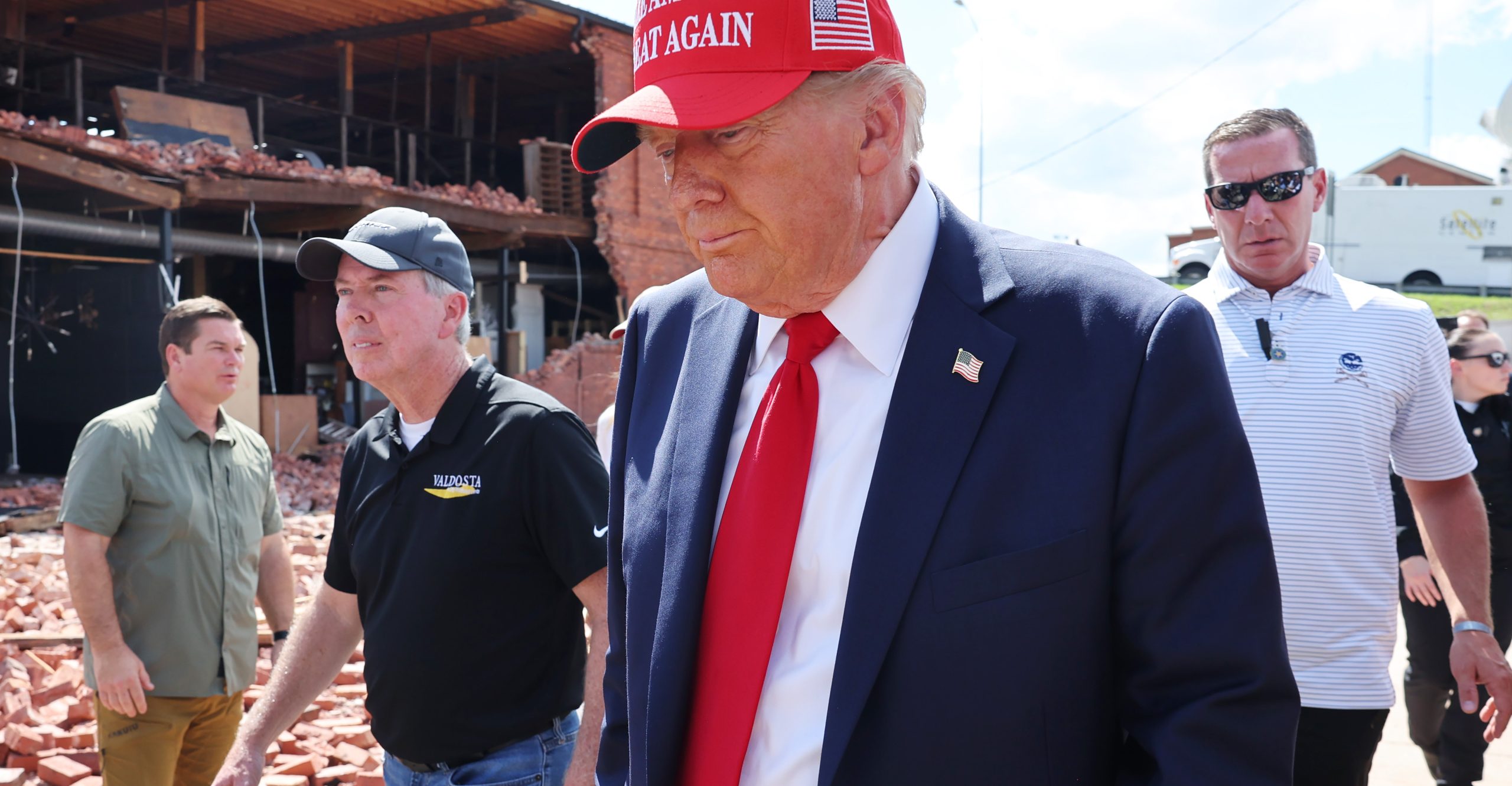 Trump wearing a MAGA hat visiting a Georgia town after Hurricane Helene Trump wearing a MAGA hat visiting a Georgia town after Hurricane Helene