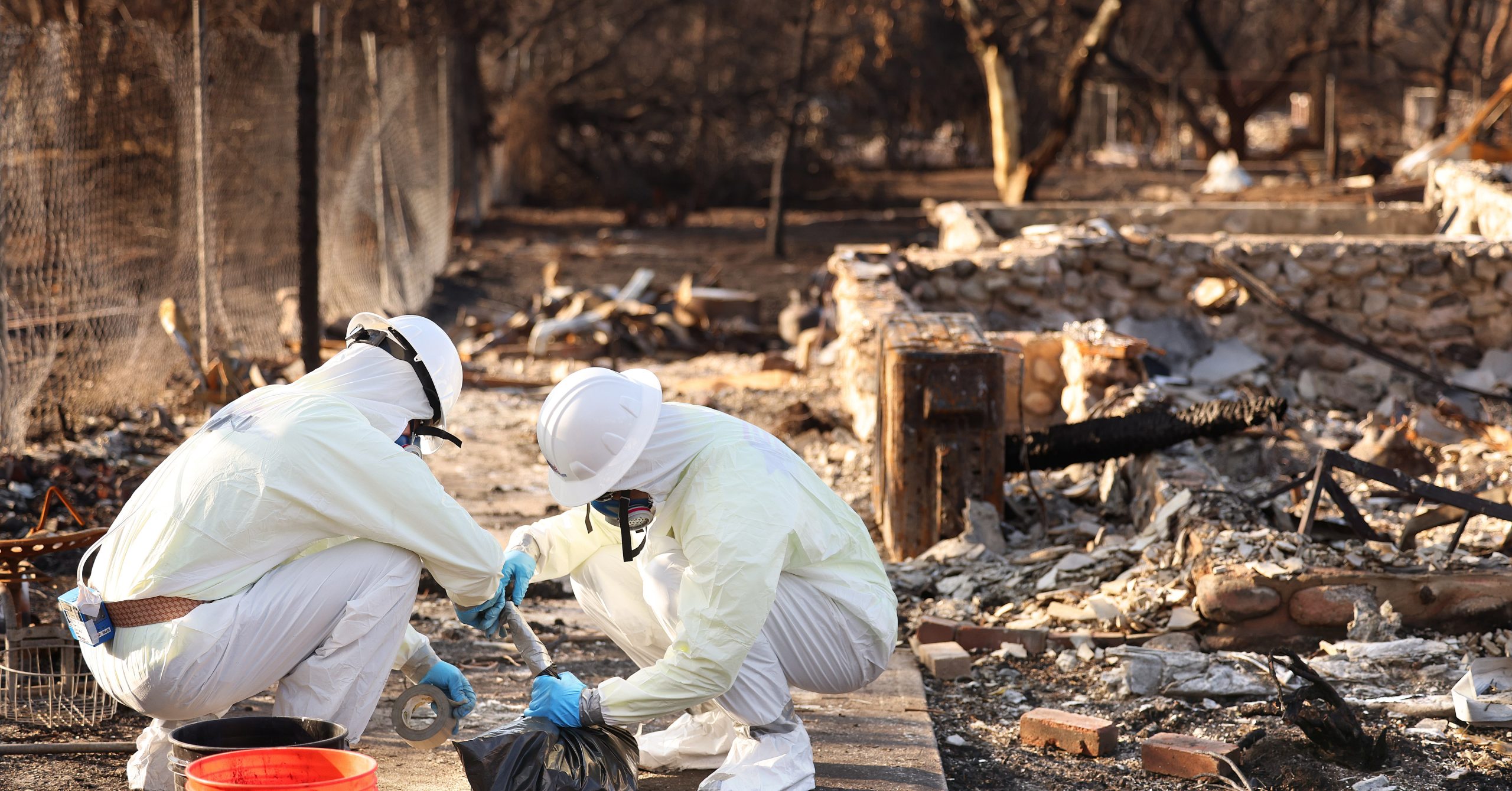 EPA contractors removing hazardous materials at a home EPA contractors removing hazardous materials at a home