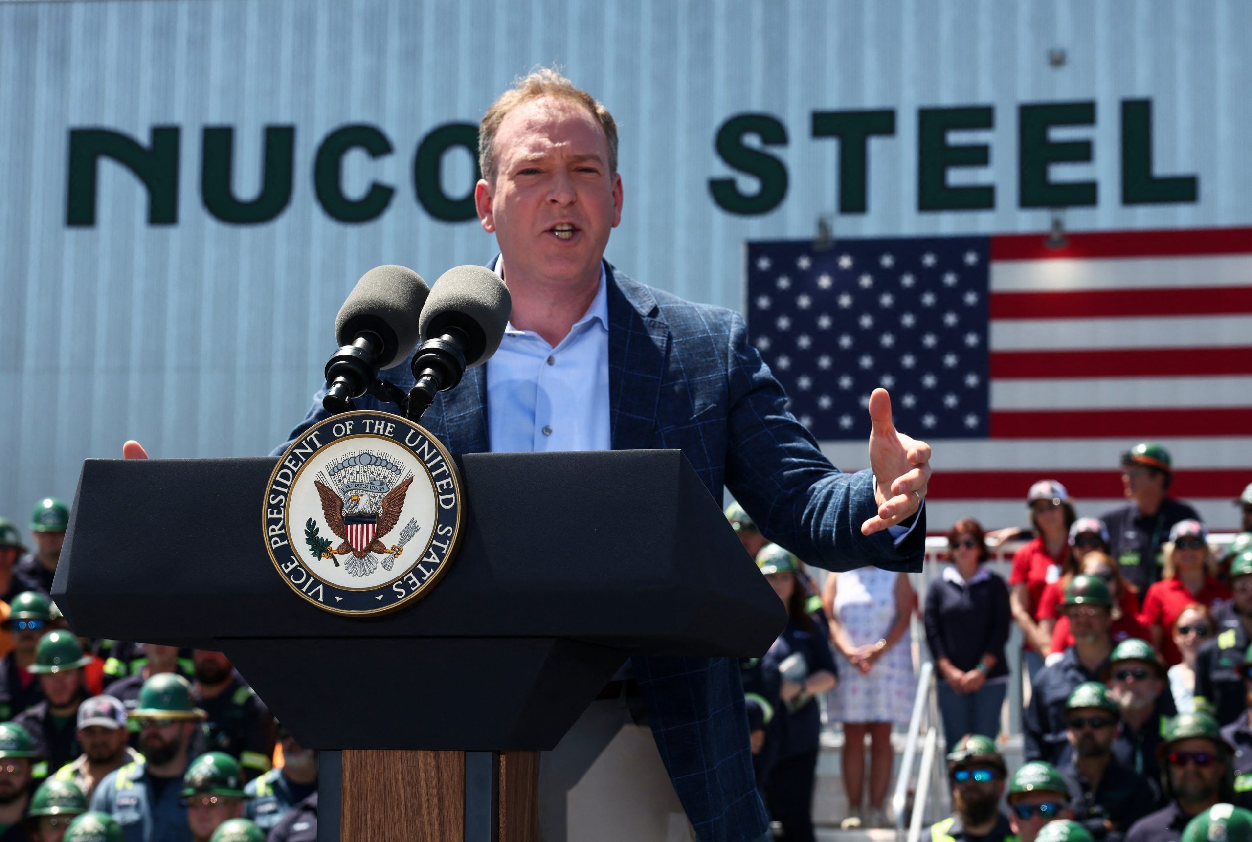 EPA administrator Lee Zeldin stands in front of a Nucor Steel building with an American flag in the background. EPA administrator Lee Zeldin stands in front of a Nucor Steel building with an American flag in the background.